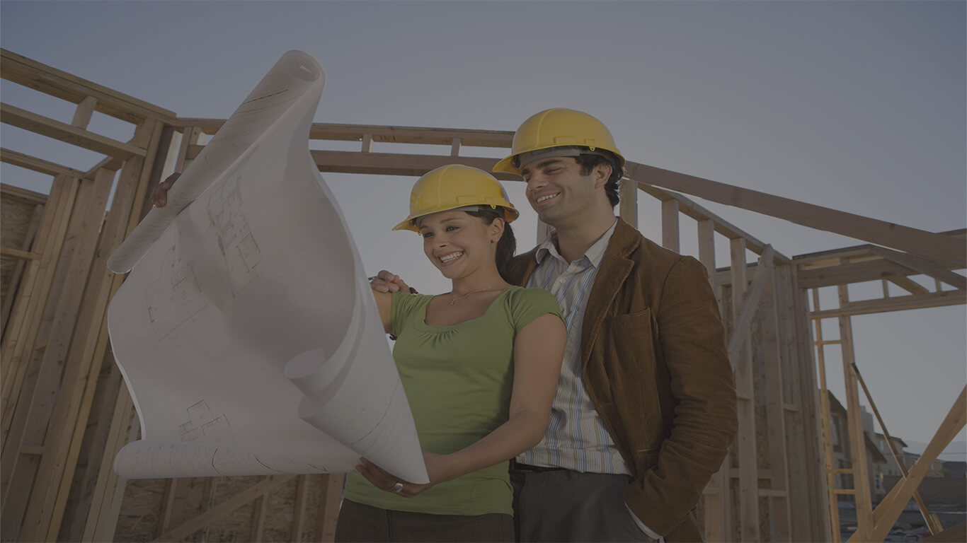 couple with plans at construction site_website